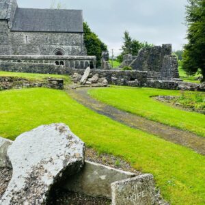 The Station of the Cross at Ballintubber Abbey with the Ruins of the East Wing of Ballintubber Abbey that will be restored as the new Cultural and Visitor Centre.