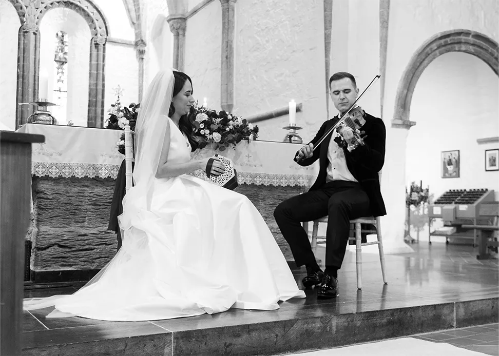 Newly weds playing music Ballintubber Abbey